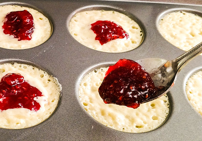 Making jelly pancakes with jelly baked inside to make a great grab and go breakfast