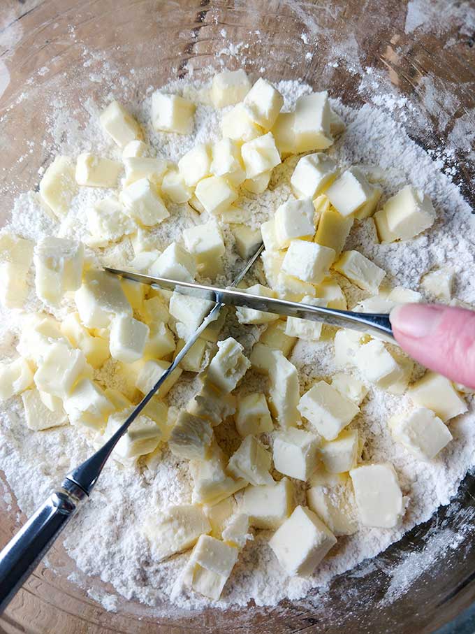 Cutting butter into flour for blueberry muffin tops