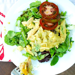 Chicken salad with curry and hot mango chutney on bed of greens