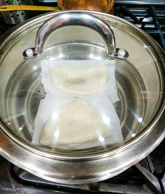 Pulled pork bao buns in steamer