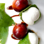 Caprese salad on a stick with heirloom tomatoes and balsamic glaze