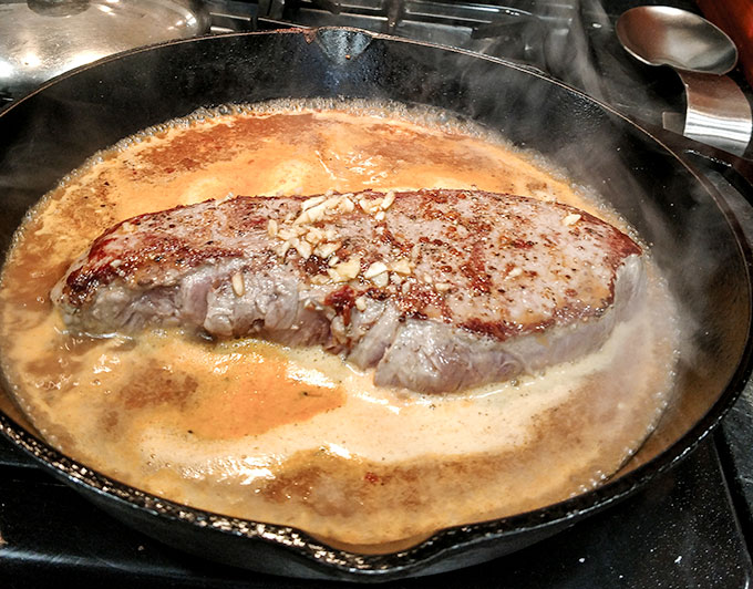 Seared beef barbacoa in juice to bake in oven