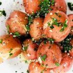 Cook new potatoes with parsley and butter