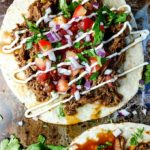 beef barbacoa tacos served open face