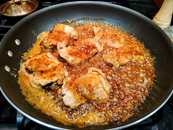 Honey Dijon chicken caramelizing in pan