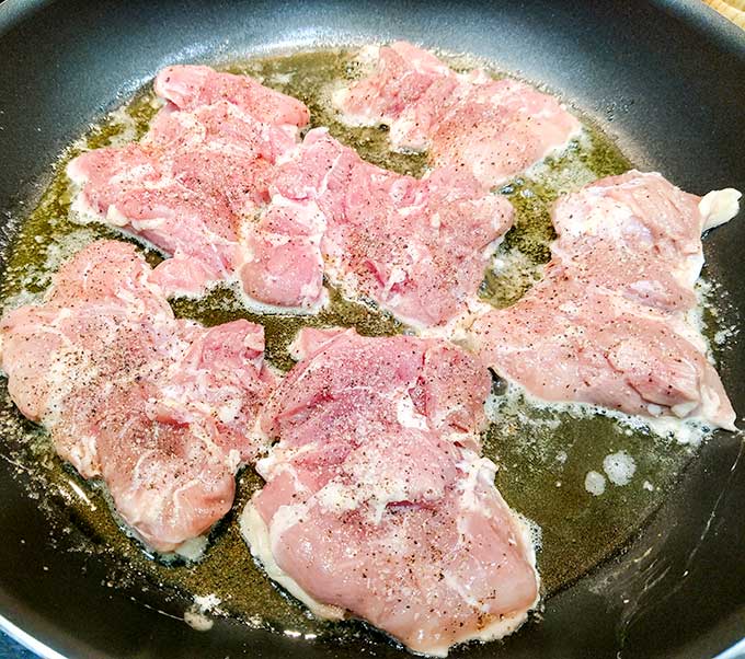 Honey Dijon chicken cooking in butter and oil