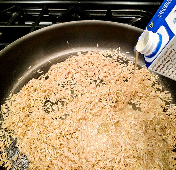 Brown and wild rice medley cooking in skillet