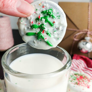 Chocolate dipped Oreo cookies with traditional Christmas tree and candy cane snow. OnTheGoBites.Com