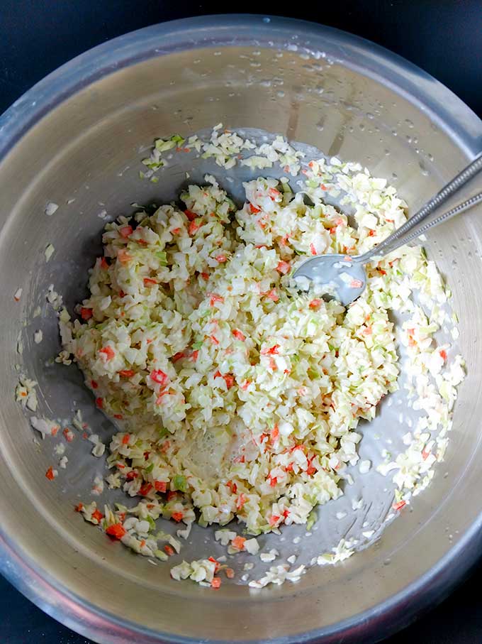 Creamy coleslaw in mixing bowl