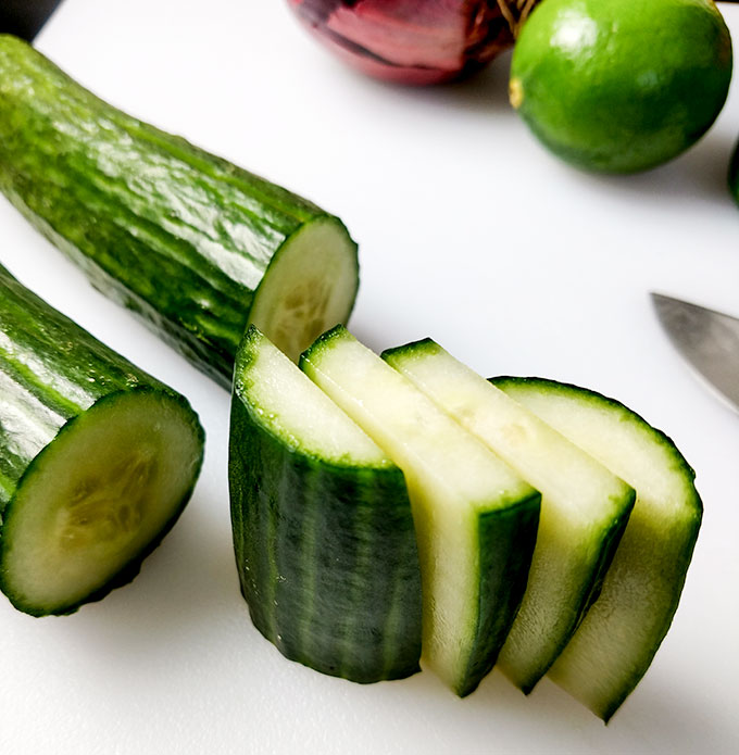 Mango salsa dicing cucumber