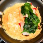 Mushroom and gruyere omelette with filling on one side