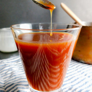 Easy homemade salted caramel sauce dripping off spoon