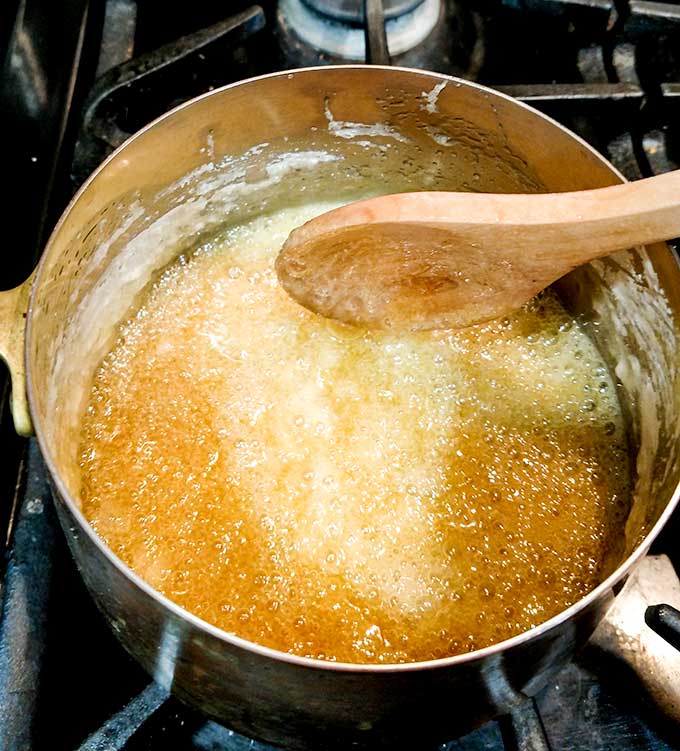 easy salted caramel sauce simmering after sugar is added