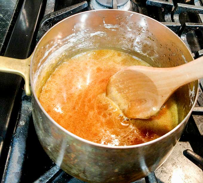 easy homemade salted caramel sauce starting to turn amber