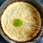 cooked shortbread crust brushed with egg white