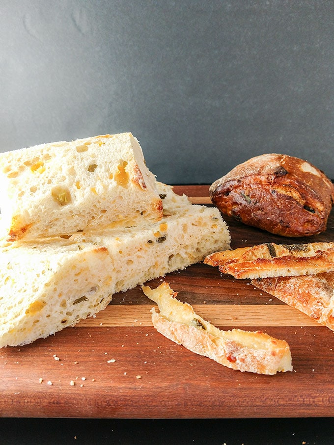 crusts cut off of dense bread for breadcrumbs