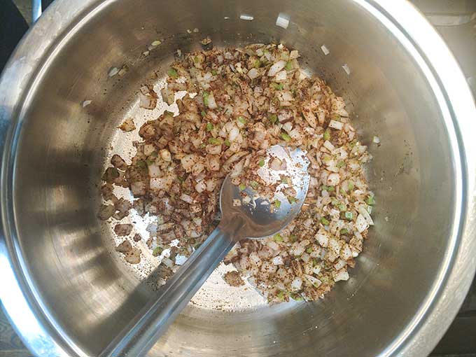 toasting the spices for chicken chili with tomatoes