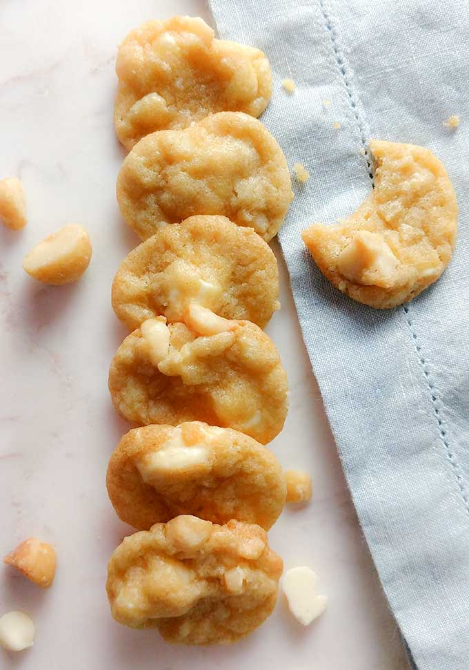 bite size white chocolate macadamia nut cookies on tray