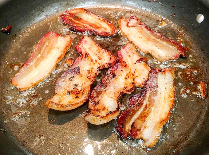 frying homemade bacon