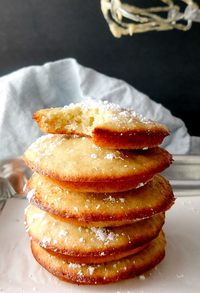 healhty banana muffin tops stacked with powdered sugar