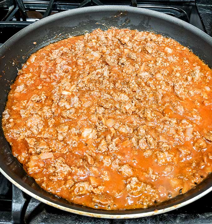 Enchilada sauce mixed with beef for Mexican pizza