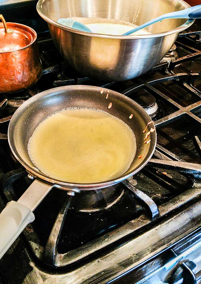 breakfast crepes cooking in skillet