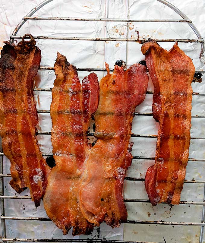 Oven bacon recipe in the oven on a rack