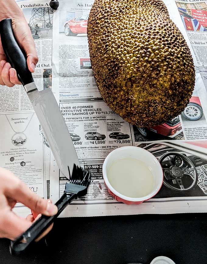 brushing oil on knife for jackfruit