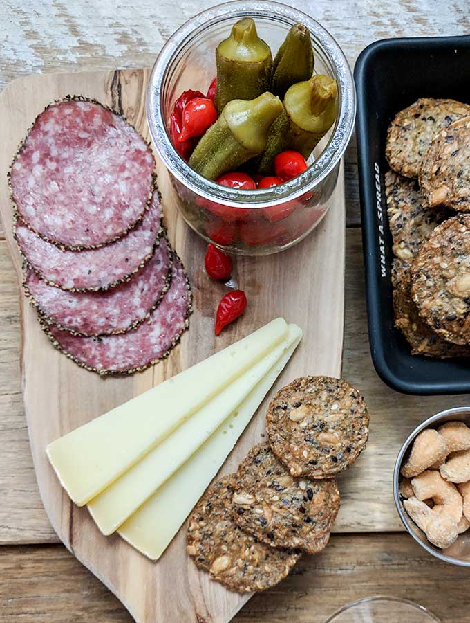 how to make a charcuterie board filled with salami and pickled okra