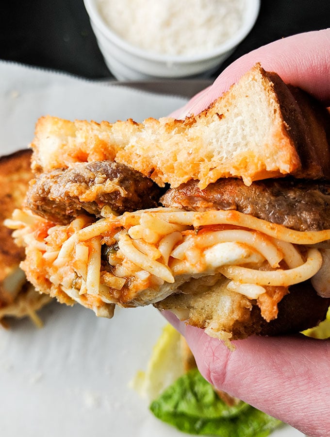 Hand held spaghetti sandwich with meatballs for an on-the-go snack