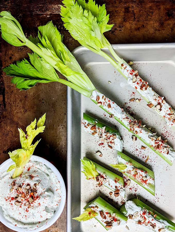 Blue cheese dip stuffed celery with leaves on