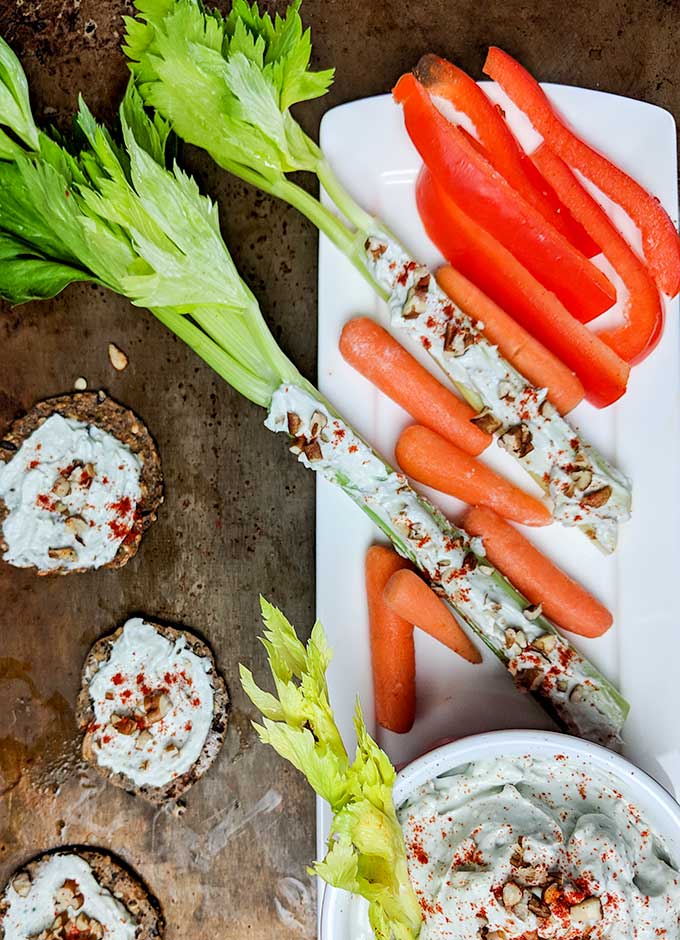 blue cheese stuffed celery with carrots, red peppers and crackers