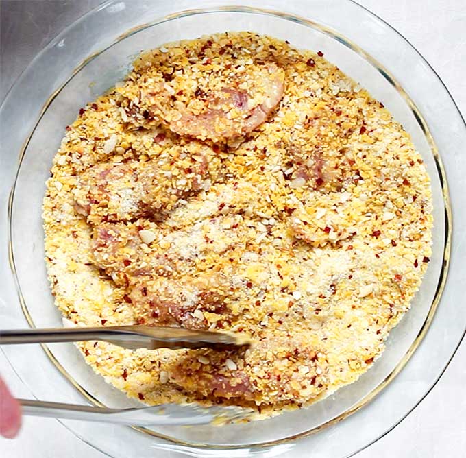 cornflake chicken tenders in corn flake mixture