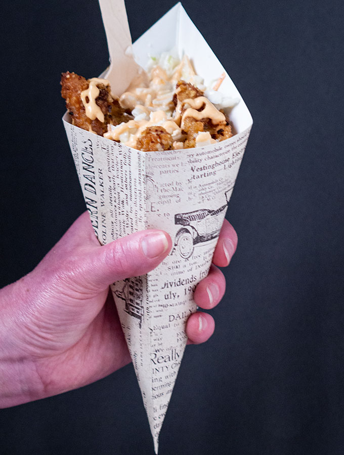 cornflake chicken tenders in a paper cone