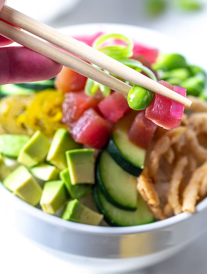 ahi poke bowl with chopsticks