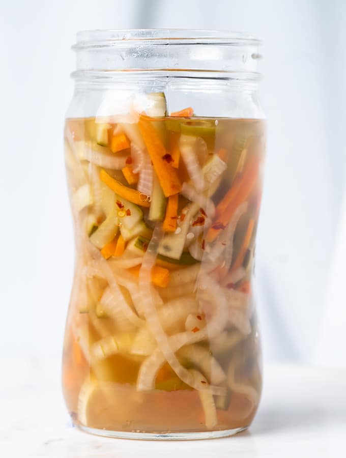 pickled vegetables with onions carrots jalapenos and cucumbers