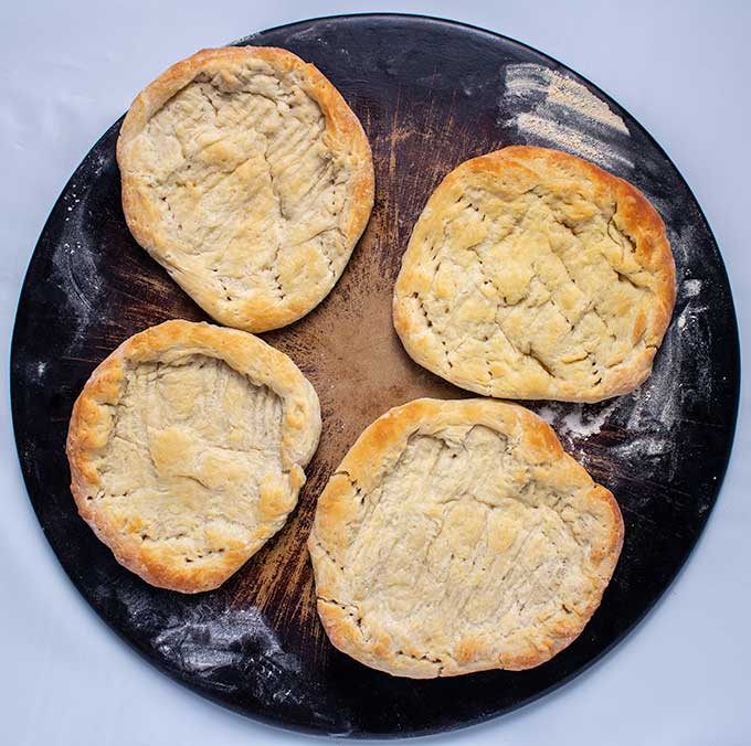 baked pizza dough for smoked salmon bagel pizza