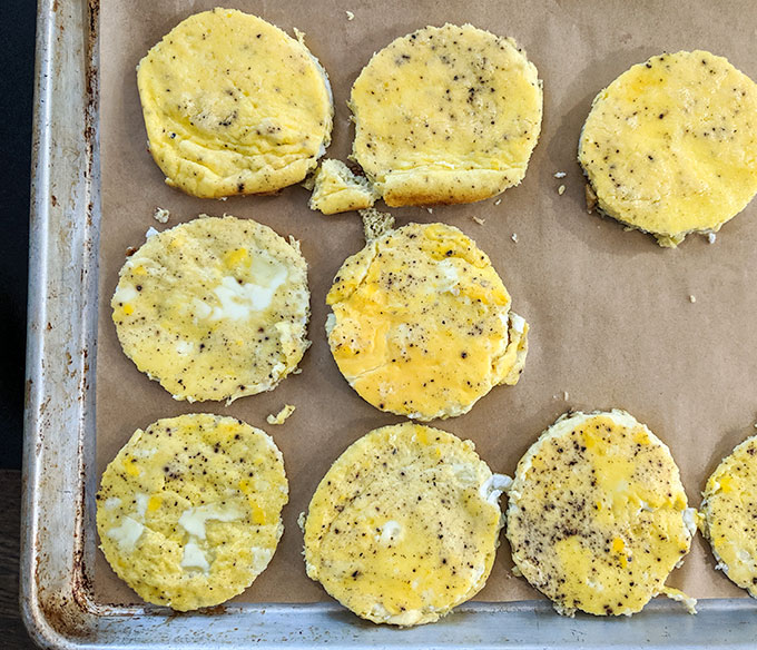 Baked egg rounds for make ahead breakfast sandwiches with ham and cheese