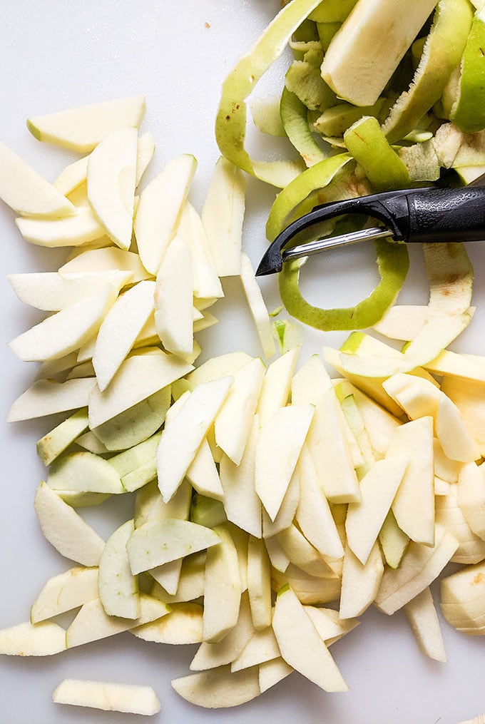 Peel and slice apples for yogurt parfait recipe