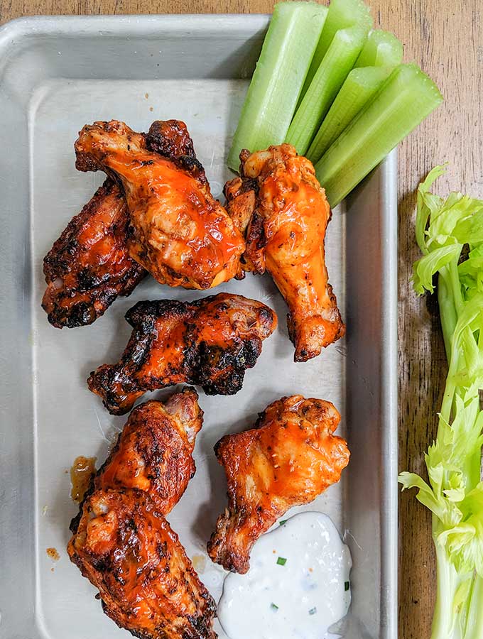 Grilled buffalo wings with celery and ranch