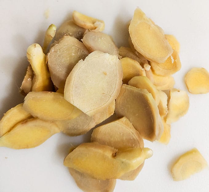 cut ginger into coins for simple syrup for cocktails