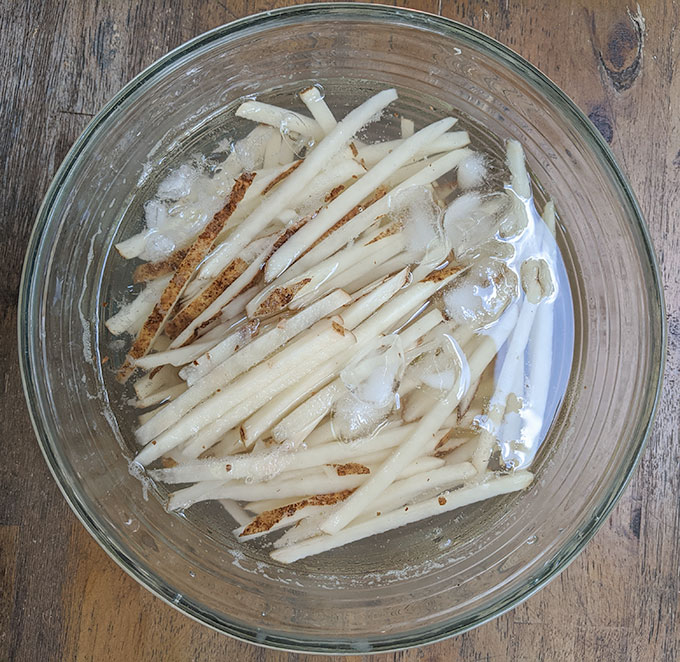 rinse homemade French fries in water