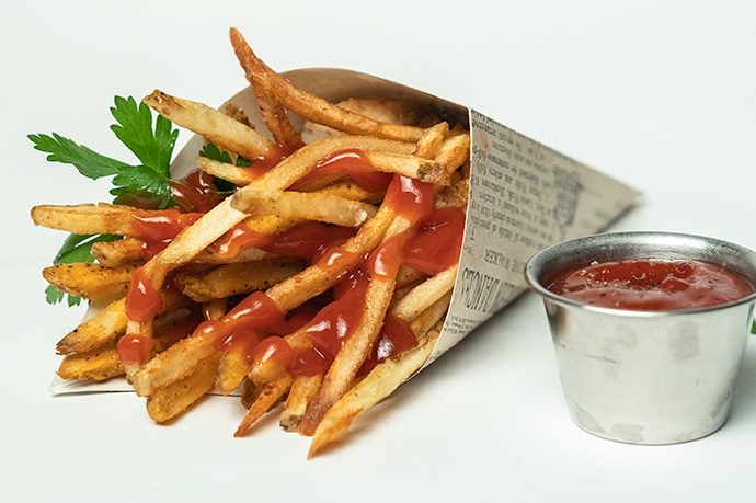 Fries in a cone with ketchup